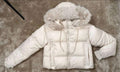 White faux fur hood puffer jacket laid flat